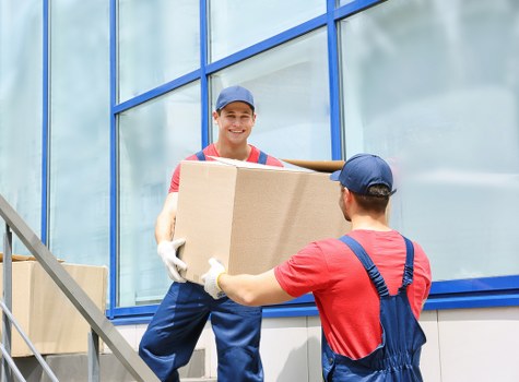 Professional packers organizing household items in Manandwan Chelsea